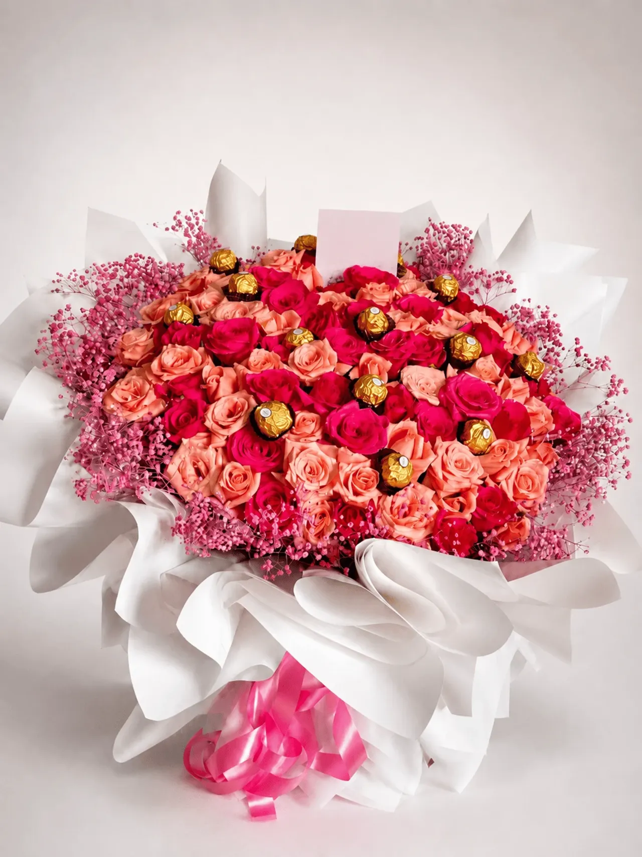 Luxury pink rose bouquet with Ferrero Rocher chocolates for flower delivery in El Jadida